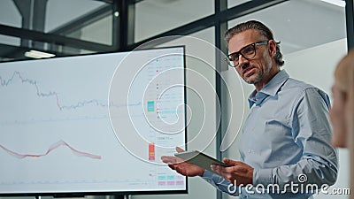 Charismatic businessman showing tv screen close up. Mentor presenting product Stock Photo