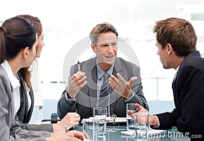 Charismatic chairman talking with his team Stock Photo