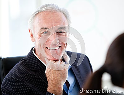 Charismatic senior businessman in a meeting Stock Photo
