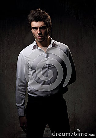 Charismatic male model posing in white style shirt and look Stock Photo