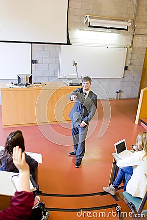 Charismatic teacher interacting with students Stock Photo