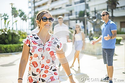 Charismatic woman in front of a group of young people Stock Photo