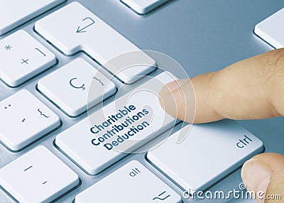 Charitable Contributions Deduction - Inscription on Blue Keyboard Key Stock Photo