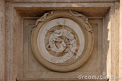 Charity Medallion on the Palazzo Montecitorio, seat of the Italian Chamber of Deputies in Rome Editorial Stock Photo