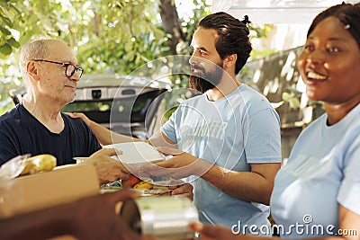 Charity workers aiding less privileged Stock Photo