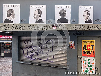 Street art : Acheter - Ah, je tâ€™ai - A jeter - Acheter. A beautiful message against consumerism Editorial Stock Photo