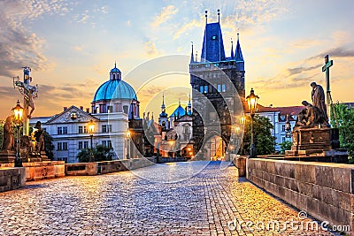 Charles Bridge and Old Town Bridge Tower in Prague at sunrise Stock Photo