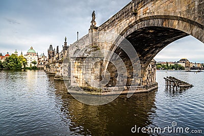 Charles Bridge in Prague against sky at sunset Stock Photo