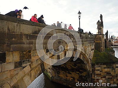 Charles Bridge is very popular for the city of Prague and an interesting piece of art Editorial Stock Photo