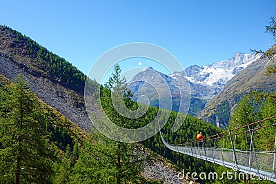 Charles Kuonen suspension bridge in Swiss Alps. With 494 metres, it is the longest suspension bridge in the world. Valais, Stock Photo