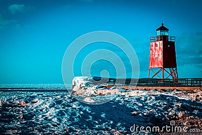 Charlevoix, MI /USA - March 3rd 2018: Charlevoix Michigans South Pier Lighthouse frozen over in winter Editorial Stock Photo