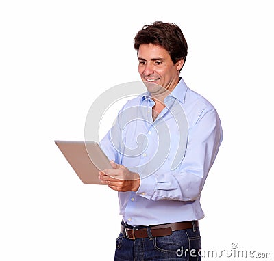 Charming adult man working on tablet pc Stock Photo