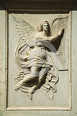 Charming angel carved in white marble at Salamanca Stock Photo