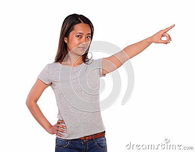 Charming asiatic young woman pointing to left up Stock Photo