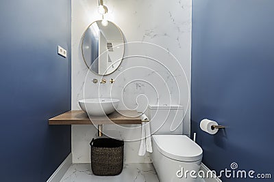 Charming bathroom with an oval mirror, a hemispherical porcelain Stock Photo