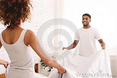 Charming beautiful couple in love making bed together Stock Photo