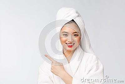 Charming beautiful young woman pointing finger. Attractive beautiful girl get surprise, happiness and love a product Stock Photo