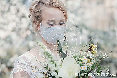 Charming bride in protective mask Stock Photo