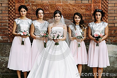 Charming bridesmaids in the fabulous dresses Stock Photo