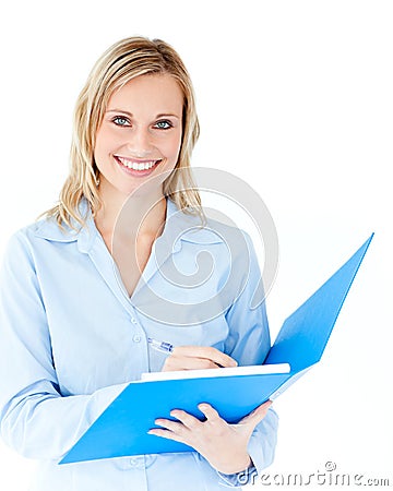 Charming businesswoman holding a folder smiling Stock Photo