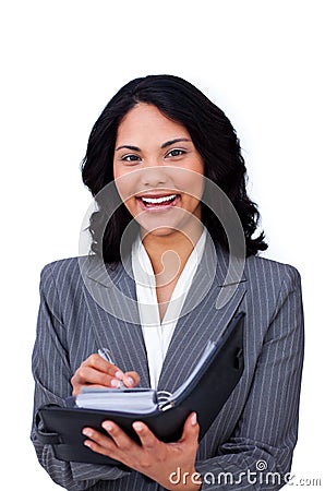 Charming businesswoman making notes on her agenda Stock Photo