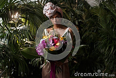 Charming calm curly hair, dark - skinned woman in white Stock Photo