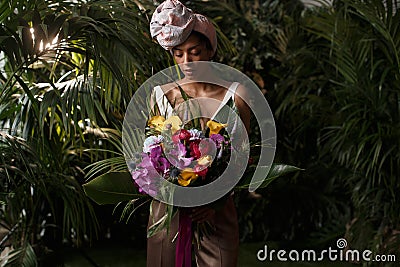 Charming calm curly hair, dark - skinned woman in white Stock Photo