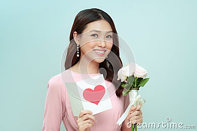 Charming elegant and feminine young woman receive flowers Stock Photo