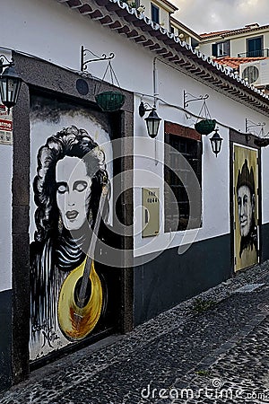 Charming Funchal Street: Old Building Adorned with Art Editorial Stock Photo