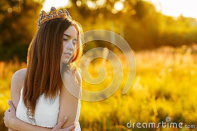 Charming girl with a crown outdoors Stock Photo