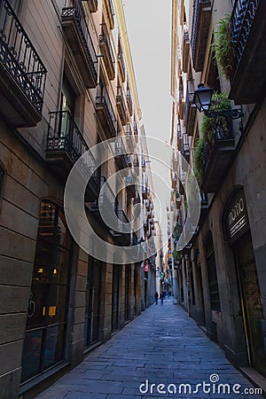 The charming Gothic Quarter, or Barri Gotic, has narrow medieval streets filled with trendy bars, clubs and Catalan restaurants. Editorial Stock Photo