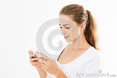 Charming joyful girl is reading pleasant text message on mobile phone from her boyfriend during her rest time. Smiling Stock Photo