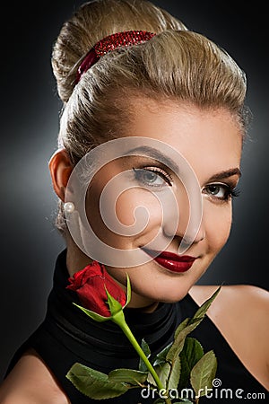 Charming lady with red rose Stock Photo