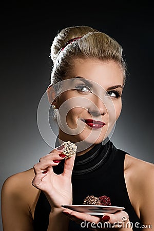 Charming lady tasting chocolate Stock Photo