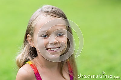 Charming little girl on a green background Stock Photo