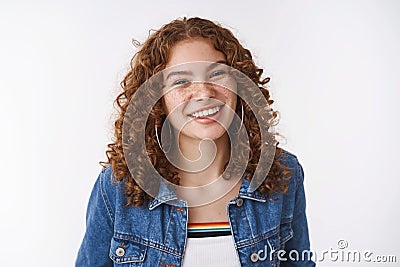 Charming lucky queer european girl ginger curly-haired freckles pimples smiling broadly without makeup having fun Stock Photo