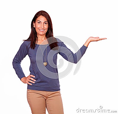 Charming mature woman holding out her palm Stock Photo