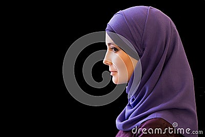 Charming Muslim woman in a scarf on her head in profile Stock Photo