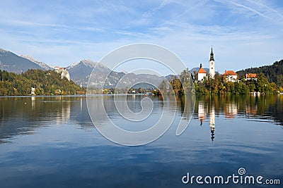 the charming natural scenery of Lake Bled with Alps at background and blue water Stock Photo