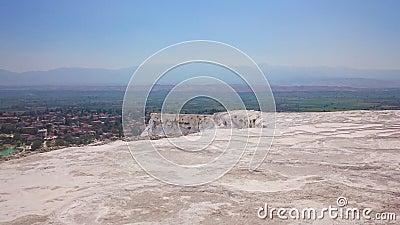 Charming Pamukkale pools in Turkey. Pamukkale contains hot springs and travertines, terraces of carbonate minerals left Stock Photo