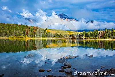 Charming Patricia Lake amongst the evergreen forests Stock Photo