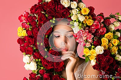 Charming portrait of pensive woman with rose flowers Stock Photo