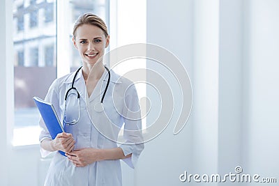 Charming practitioner expressing delight at work Stock Photo