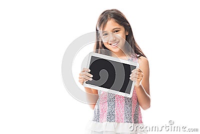 Child playing on tablet pc while standing against white background Stock Photo