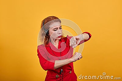Charming redhead caucasian young woman dancing, enjoying mussic, dancing Stock Photo