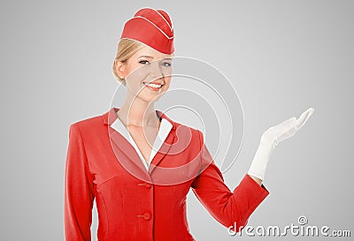 Charming Stewardess Dressed In Red Uniform Holding In Hand Stock Photo