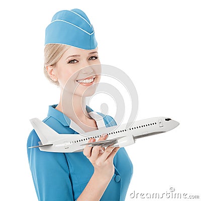 Charming Stewardess Holding Airplane In Hand. Isolated Stock Photo