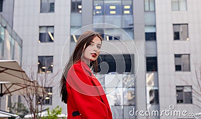 Charming stunning elegant girl black golf and a red autumn coat looks sexy and tender in the frame Stock Photo