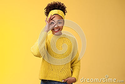 Charming tender feminine african-american girlfriend show circle on eye ok okay gesture look lucky happily smiling Stock Photo