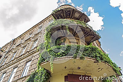 Charming view of an ancient house with green balconies Stock Photo
